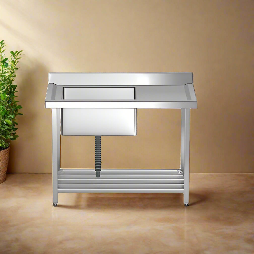 Stainless steel kitchen prep table with sink on a white background